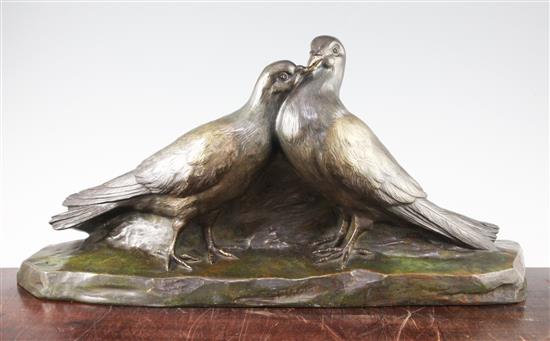 A French Art Deco patinated bronze model of two doves, 25.5in.